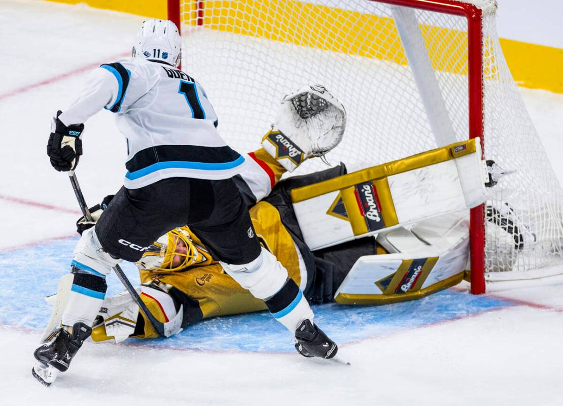 Golden Knights goaltender Adin Hill (33) is scored on by Utah Mammoth right wing Dylan Guenther ...
