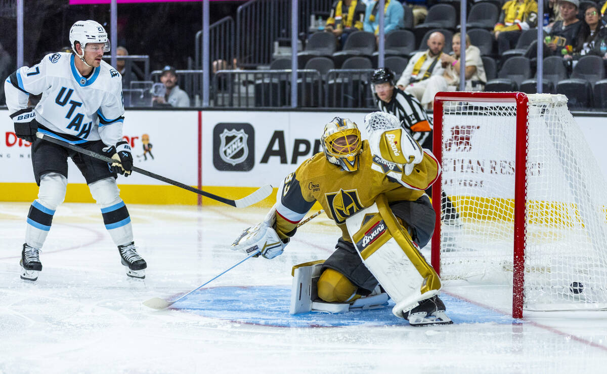 Golden Knights goaltender Adin Hill (33) lets a puck gets past for a score by Utah Mammoth cent ...