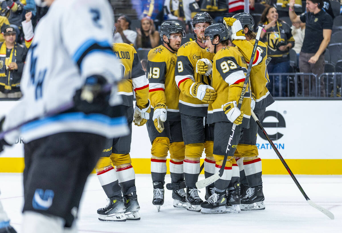 Golden Knights players celebrate a goal against the Utah Mammoth during the third period of the ...
