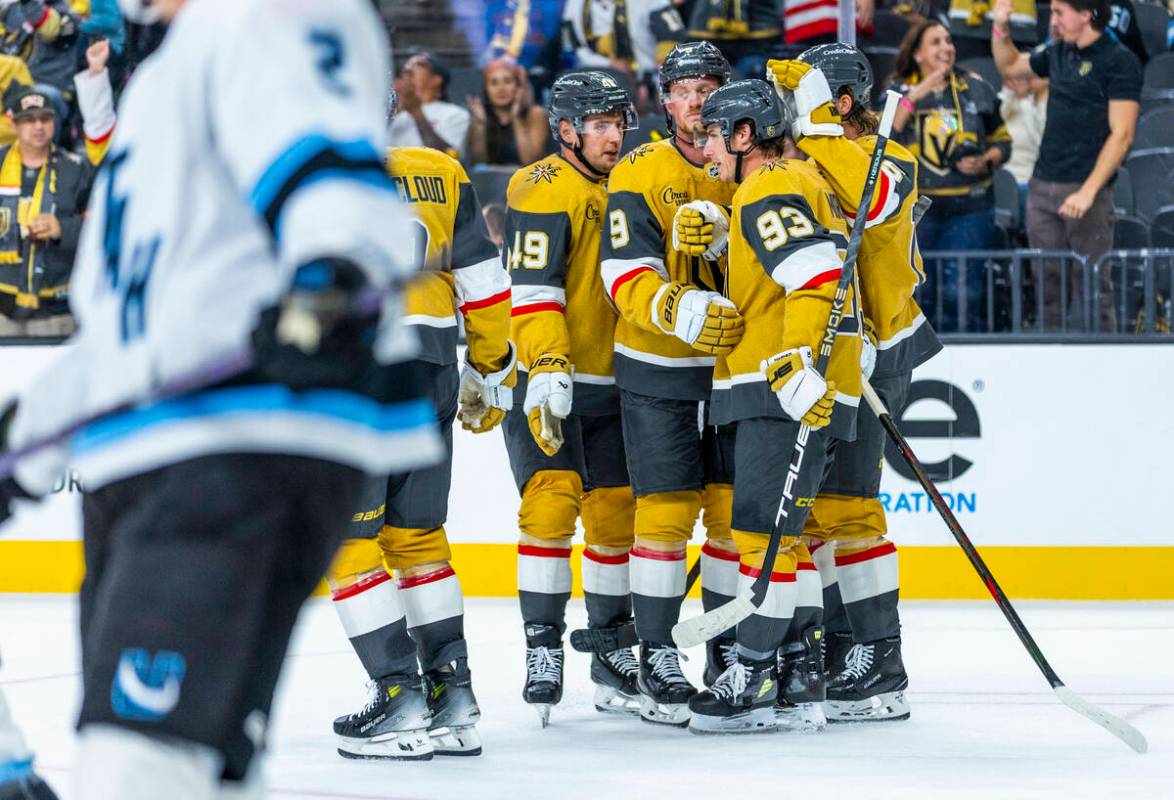 Golden Knights players celebrate a goal against the Utah Mammoth during the third period of the ...