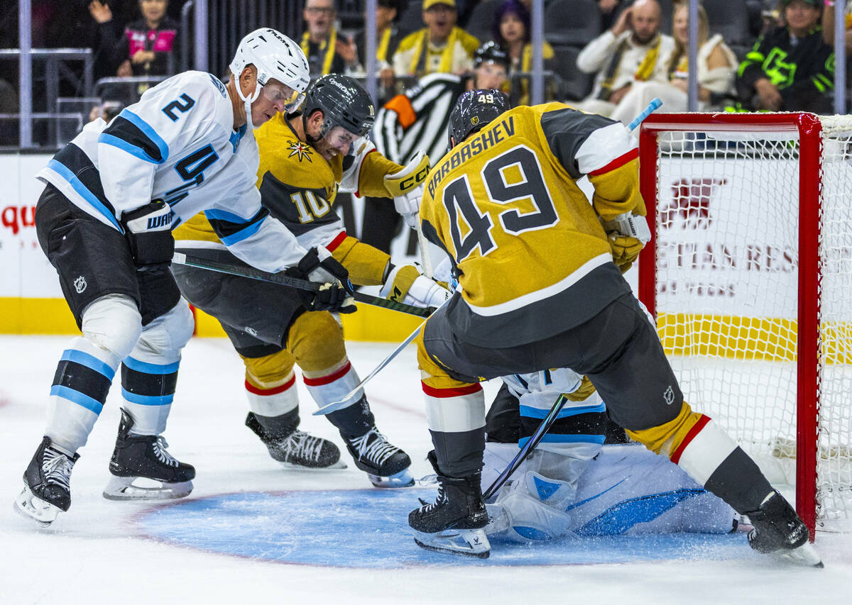 Golden Knights center Colton Sissons (10) battles Utah Mammoth defenseman Olli Määtt& ...