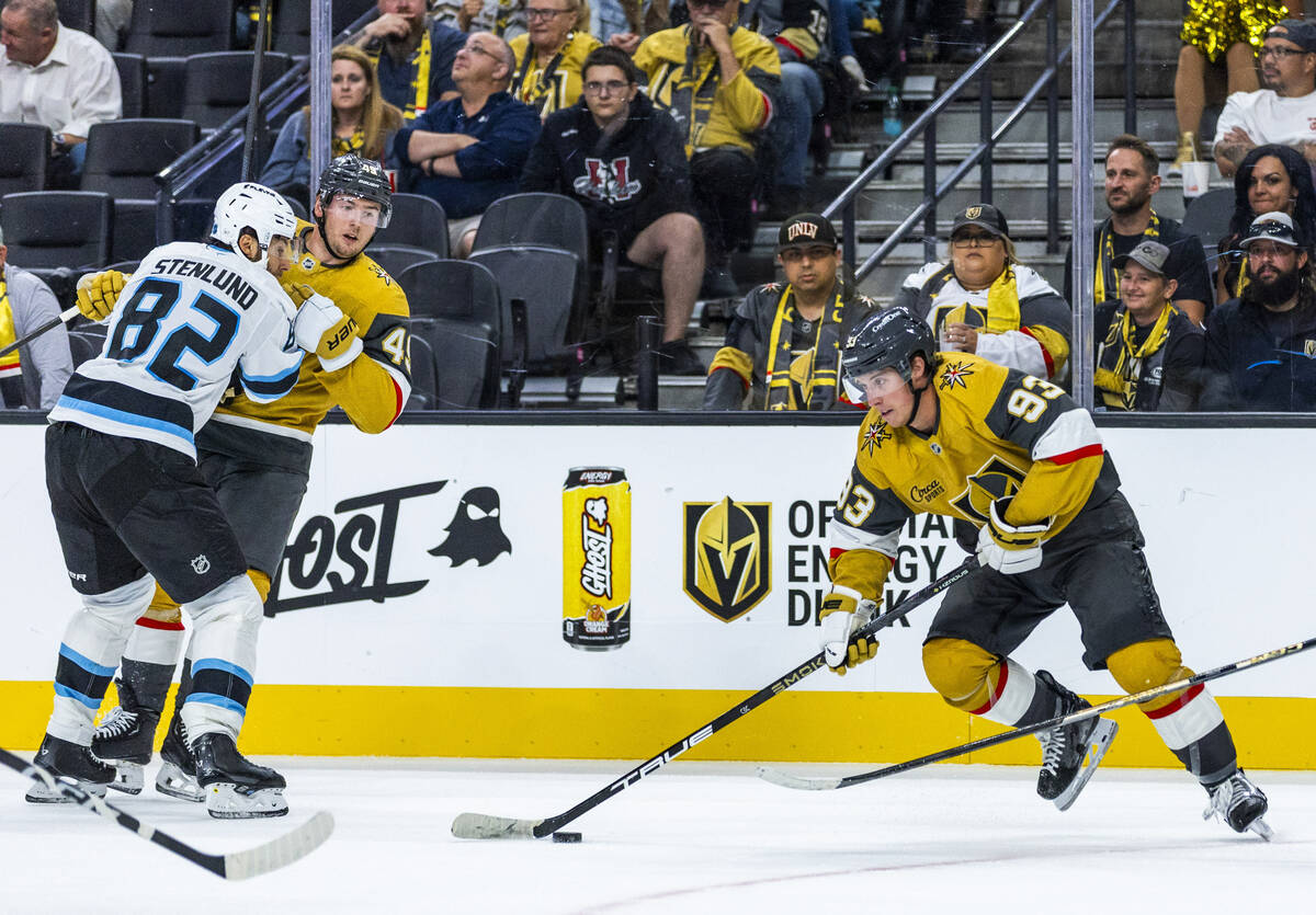 Golden Knights right wing Mitch Marner (93) looks to pass as left wing Ivan Barbashev (49) is t ...