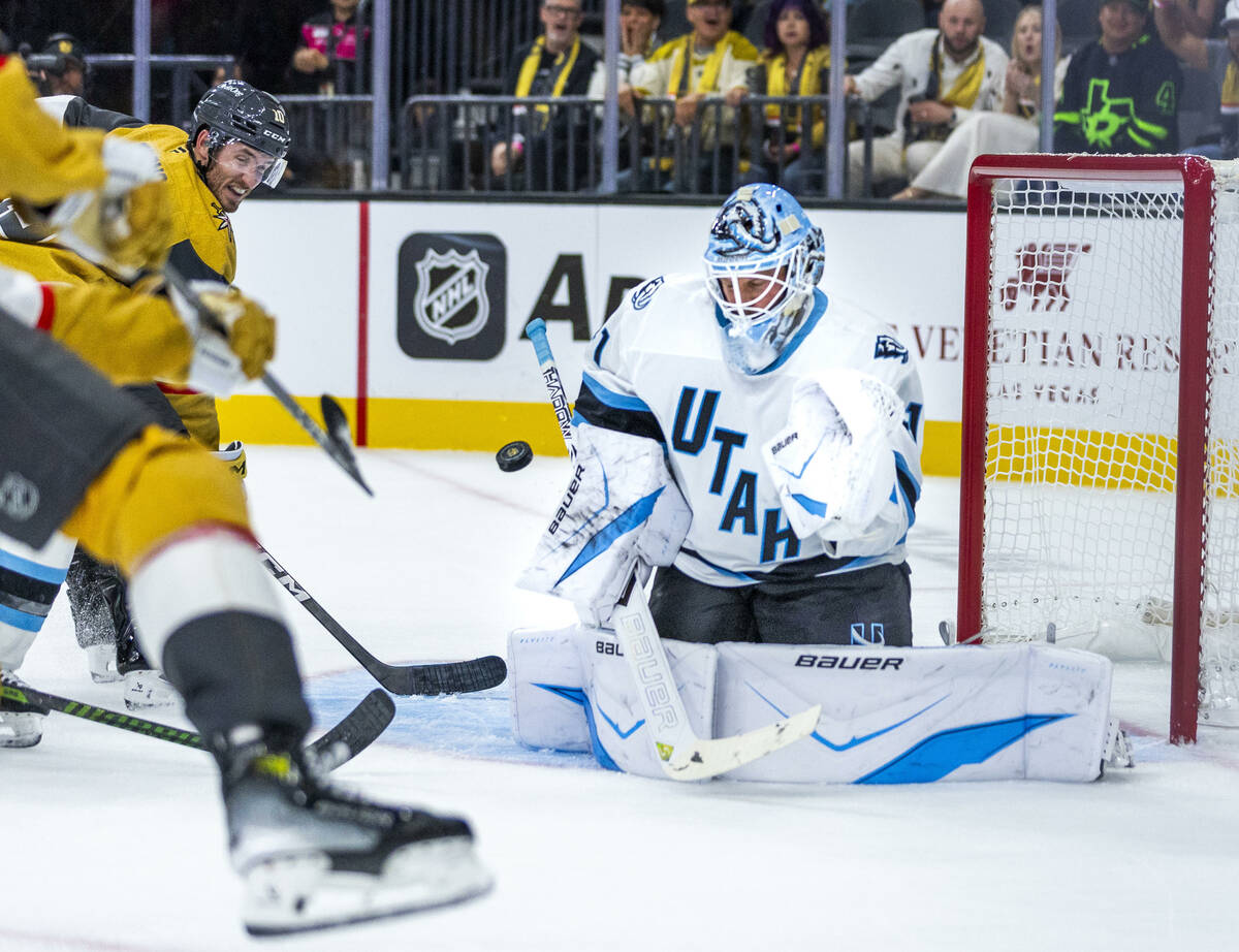 Golden Knights center Colton Sissons (10) sends a puck towards Utah Mammoth goaltender Vitek Va ...