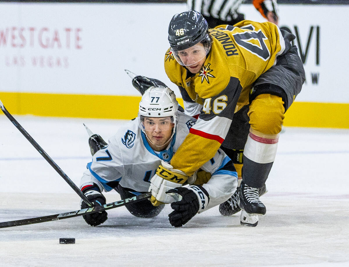 Utah Mammoth right wing JJ Peterka (77) goes to the ice chasing a puck with Golden Knights righ ...