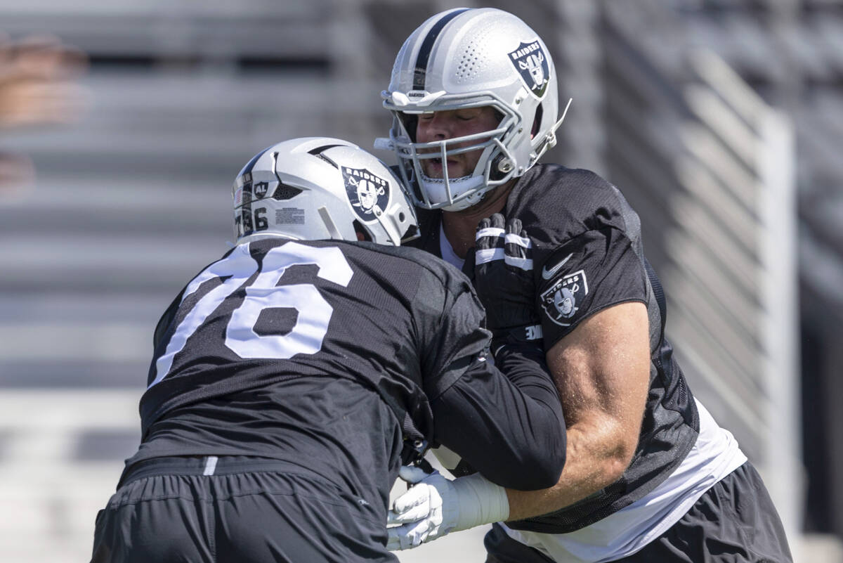Raiders guard Caleb Rogers (76) works against offensive lineman Jordan Meredith (61) during the ...