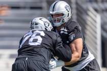 Raiders guard Caleb Rogers (76) works against offensive lineman Jordan Meredith (61) during the ...
