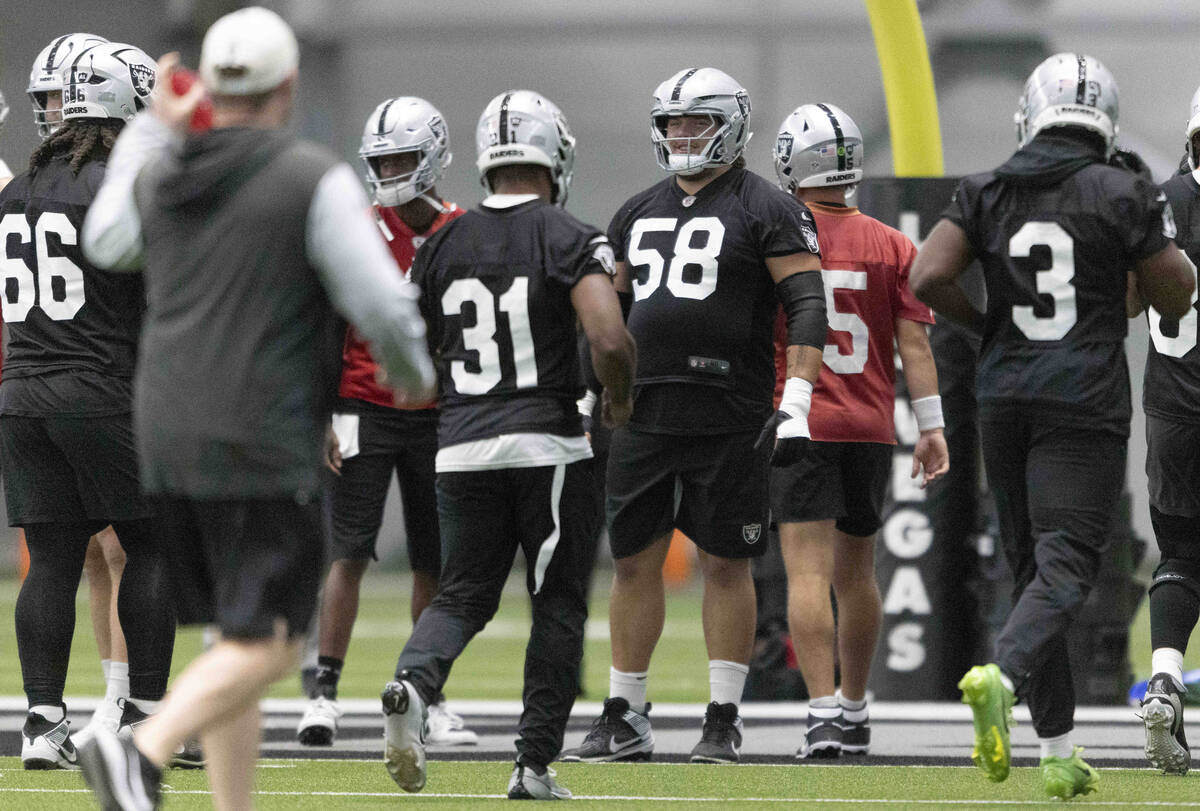 Raiders guard Jackson Powers-Johnson (58) waits to run a warm up drill during the team’s ...