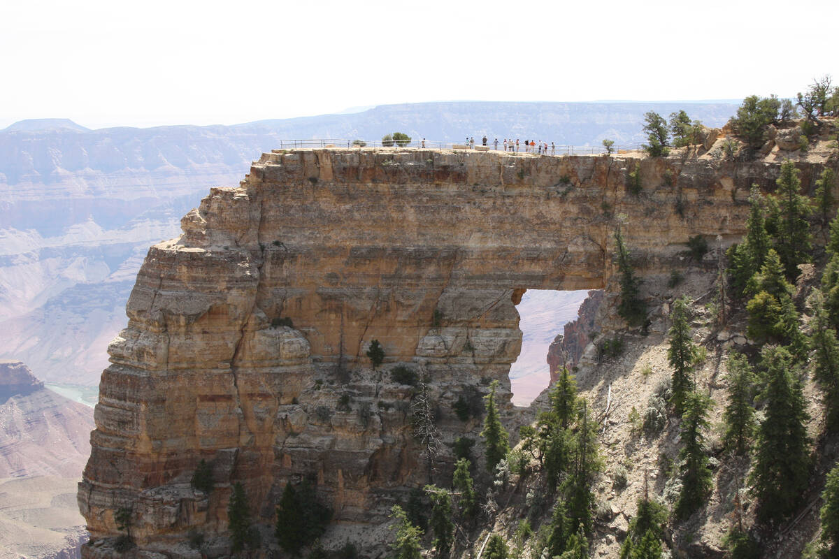 Hikers stand above Angels Window just a five minute hike from Cape Royal Road. (Deborah Wall/La ...