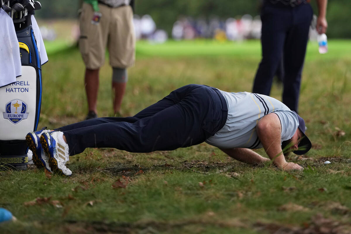 Europe's Tyrrell Hatton looks at the ball in the rough on the seventh hole at Bethpage Bla ...