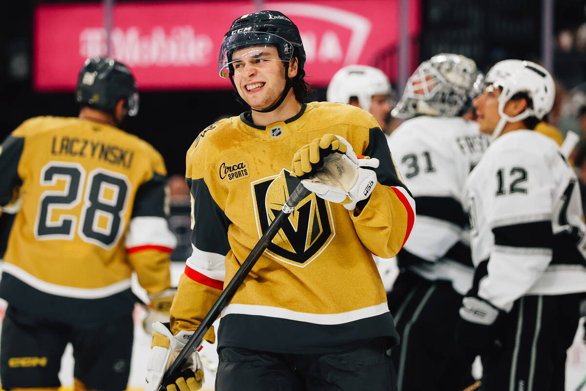 Golden Knights center Mathieu Cataford (8) smiles as fans react to a failed goal attempt by a t ...