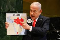 Israeli Prime Minister Benjamin Netanyahu holds up a map while speaking at the 80th session of ...