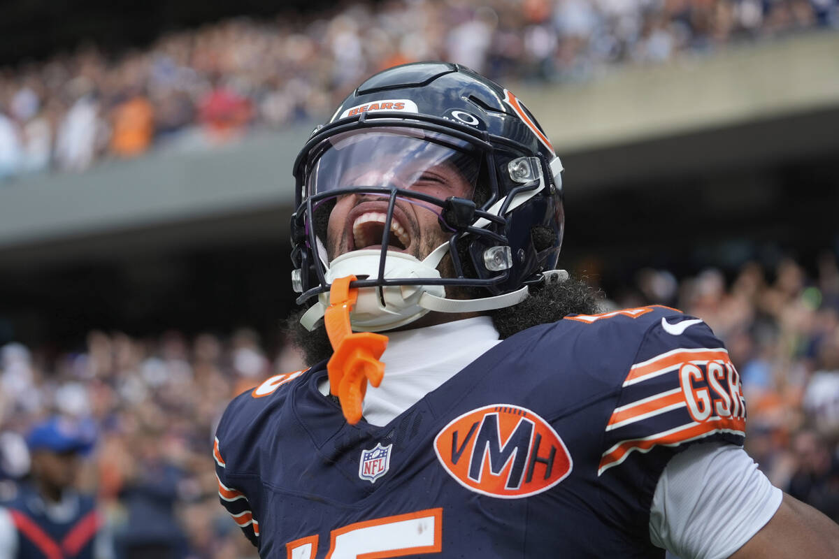 Chicago Bears wide receiver Rome Odunze celebrates after catching a touchdown pass in the first ...