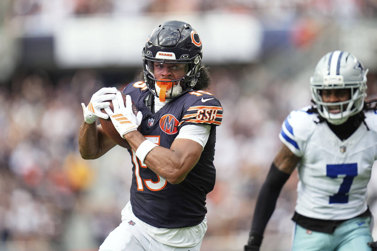 Chicago Bears wide receiver Rome Odunze sprints to the end zone for a touchdown after catching ...