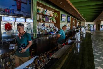 Bar staff stock up for an expected first day crowd at the new Palm Tree Beach Club at the MGM G ...