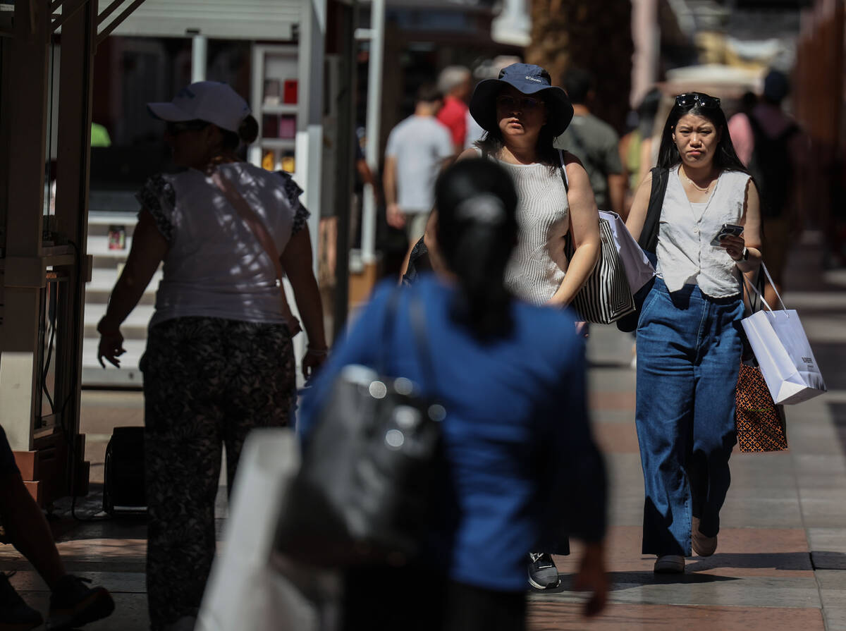 People shop at Las Vegas North Premium Outlets on Monday, Aug. 18, 2025, in Las Vegas. (Benjami ...