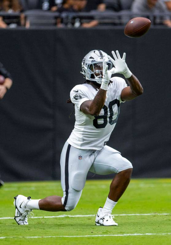 Raiders tight end Ian Thomas (80) looks in a long pass during the first half of a Raiders train ...