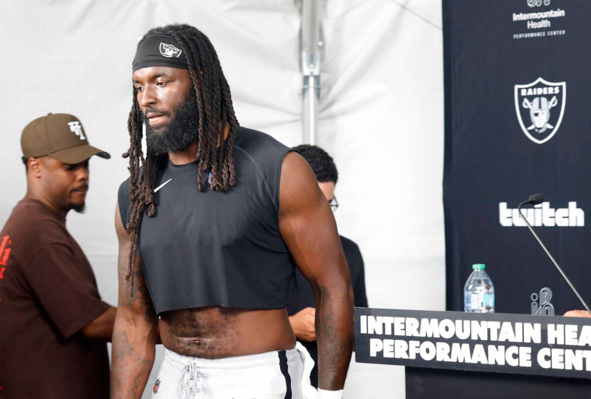 Raiders tight end Ian Thomas leaves the podium after speaking to the media after the team&#x201 ...