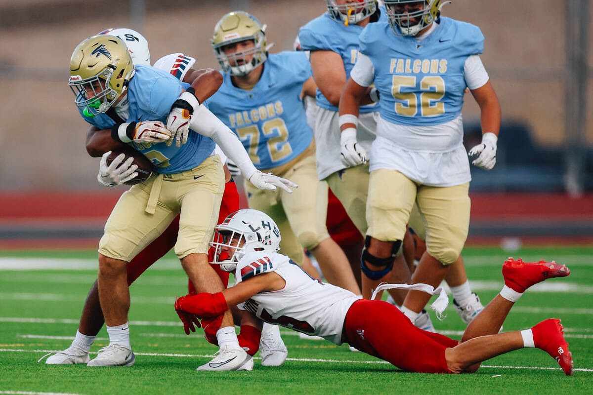 Foothill wide receiver Nixon Gasperosky (2) carries the ball during a high school football game ...