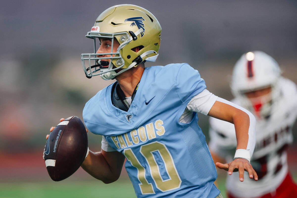 Foothill quarterback Ryder Dobbs scrambles during a high school football game between Liberty a ...