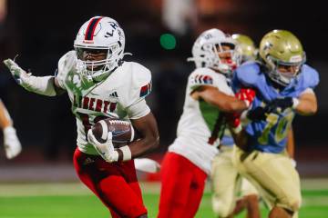 Liberty tight end Aiden Webster runs the ball during a high school football game between Libert ...