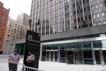 FILE - Security guards stand outside the Jacob K. Javits Federal Office Building at 26 Federal ...