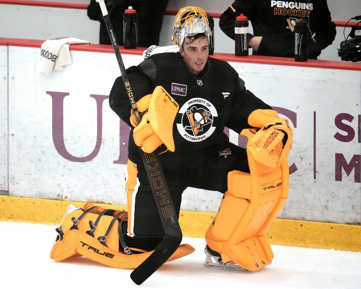 Pittsburgh Penguins goalie Marc-Andre Fleury waits his turn in net during the NHL hockey team&# ...