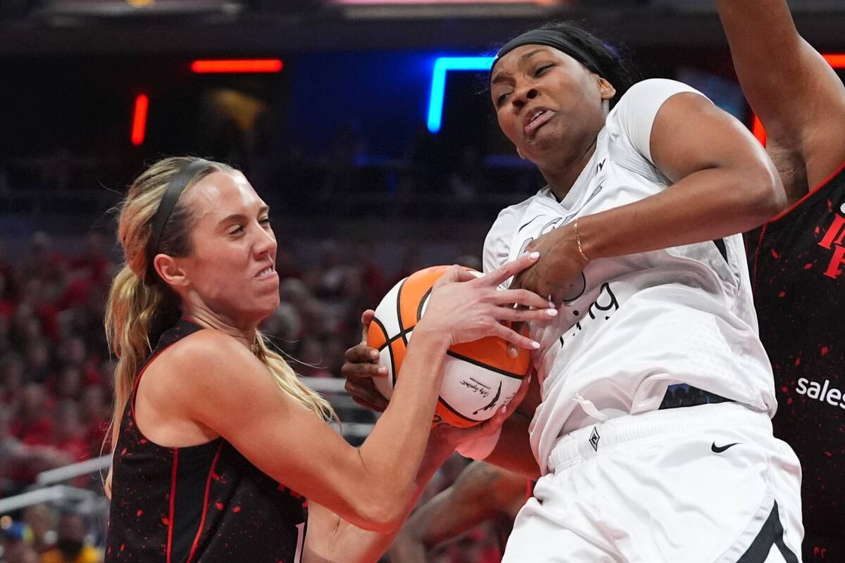Las Vegas Aces' NaLyssa Smith, right, is tied up by Indiana Fever's Lexie Hull during ...