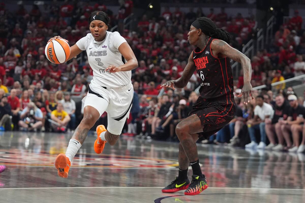 Las Vegas Aces' NaLyssa Smith (3) goes to the basket against Indiana Fever's Natasha ...