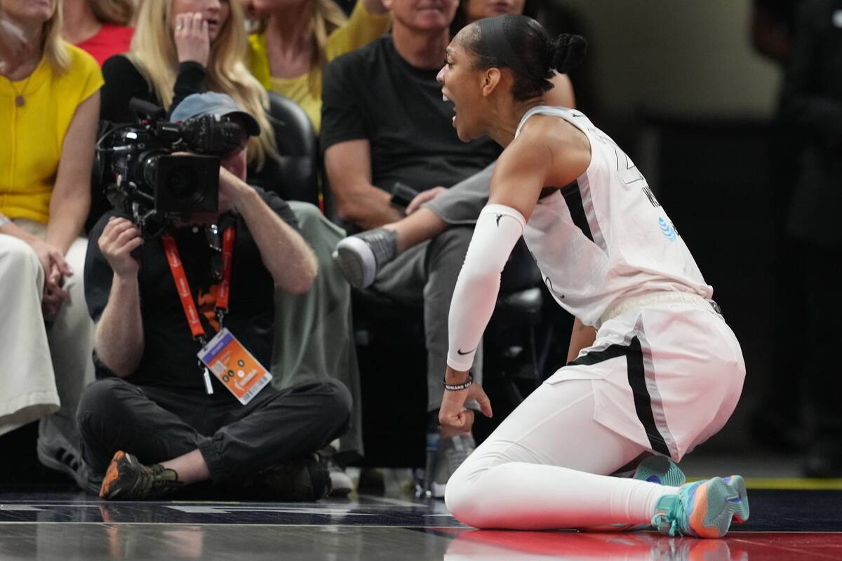 Las Vegas Aces' A'ja Wilson reacts after hitting a shot and getting fouled during sec ...