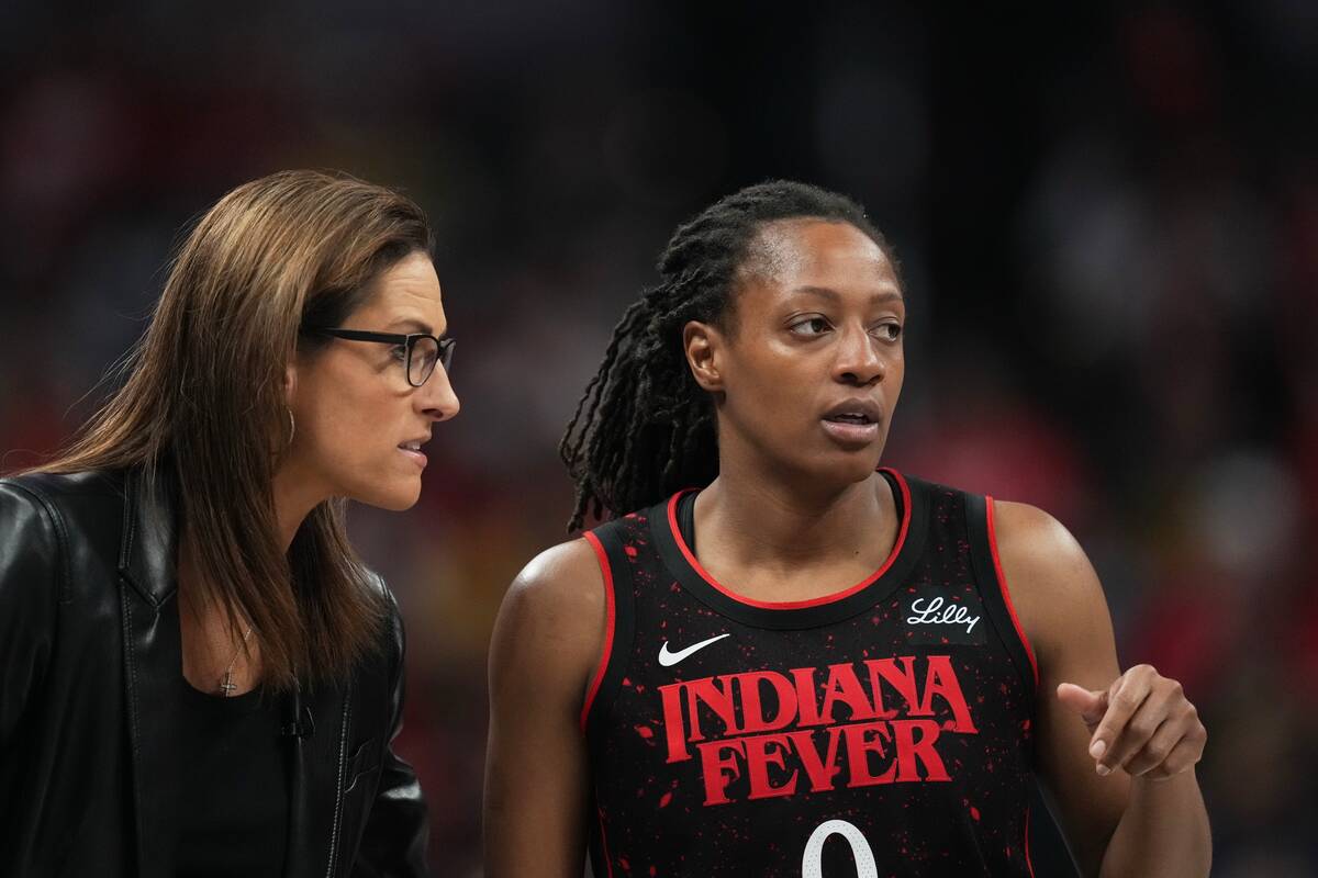 Indiana Fever head coach Stephanie White talks with Kelsey Mitchell during second half of Game ...