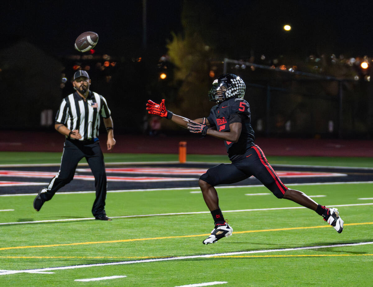 Las Vegas’s Dasean Deayon (5) reaches for the ball during a football game against Green Valle ...