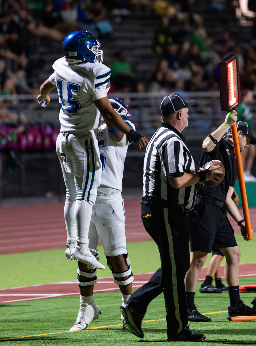 Green Valley players celebrate after a touchdown by Green Valley’s QB Michael Lewis (15) ...