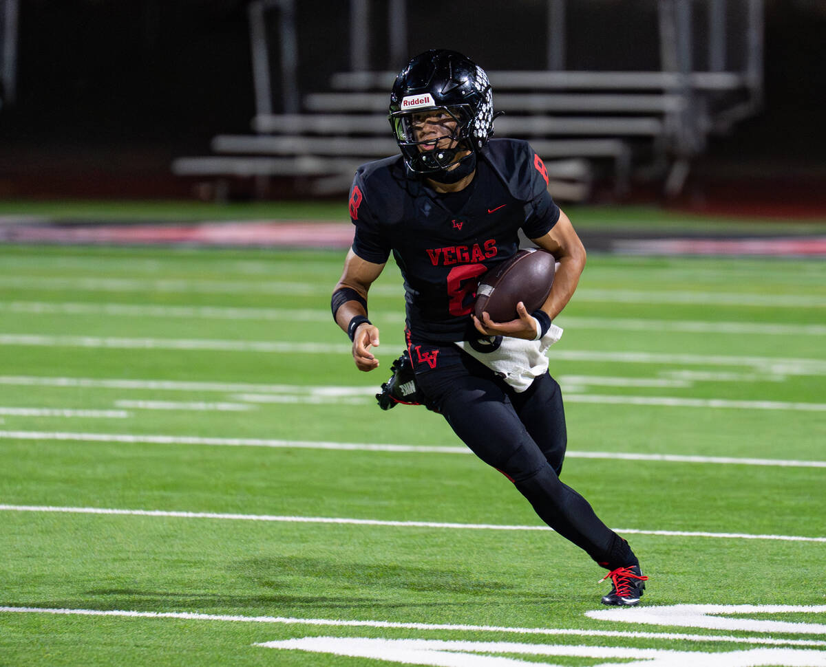 Las Vegas’s QB Tanner Vibabul (8) looks for an open pass during a football game against ...