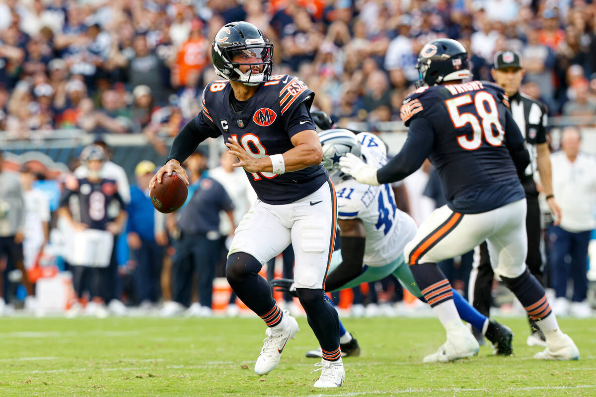 Chicago Bears quarterback Caleb Williams (18) looks to pass the ball during the second half of ...