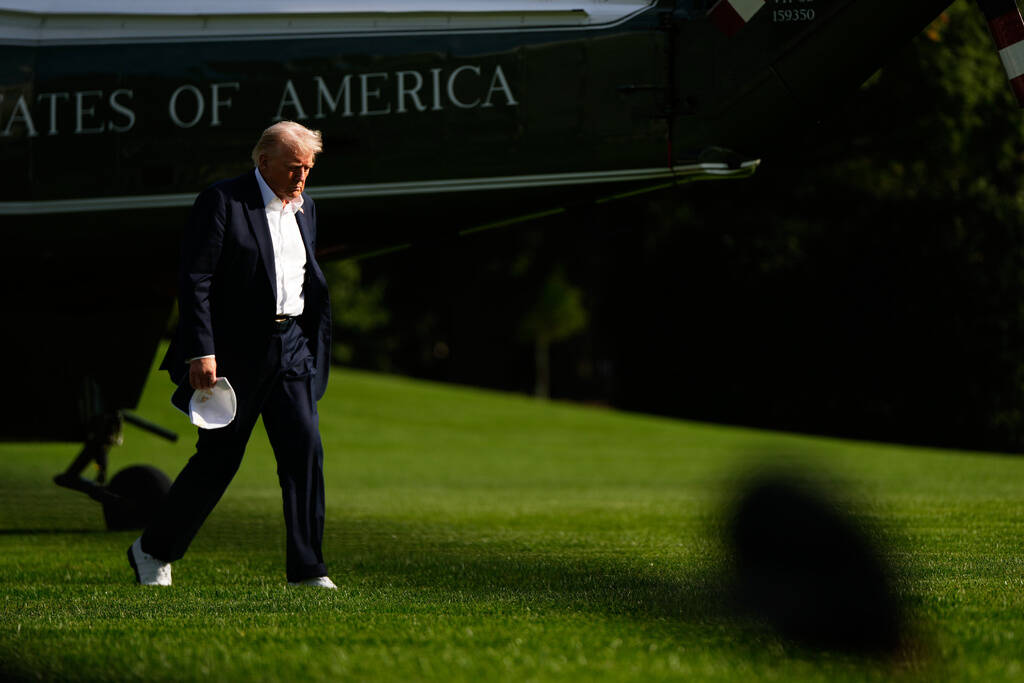 President Donald Trump arrives at the White House, Friday, Sept. 26, 2025, in Washington. (AP P ...