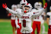Liberty wide receiver Kellen Iwamuro reacts to a call by a referee during a high school footbal ...