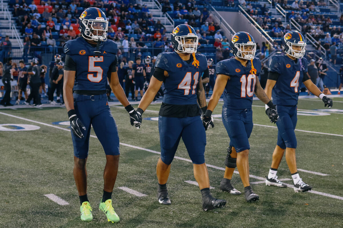 Bishop Gorman’s Jett Washington (5), Prince Williams (41), Tamatoa Gaoteote (10) and Kai ...