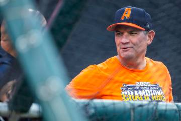 Aviators head coach Fran Riordan chats with a friend before the start of their Triple-A basebal ...