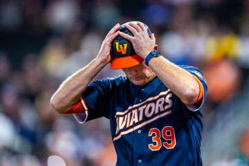 Aviators manager Fran Riordan (39) puts his hands on his helmet in the final inning against the ...