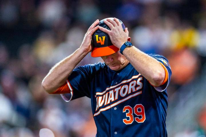 Aviators manager Fran Riordan (39) puts his hands on his helmet in the final inning against the ...