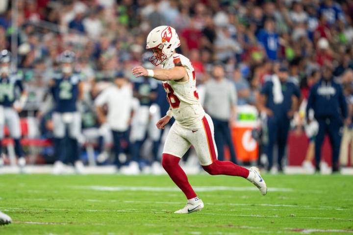 Arizona Cardinals kicker Chad Ryland (38) runs to kick the ball during a NFL football game agai ...