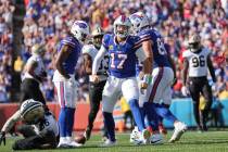 Buffalo Bills quarterback Josh Allen (17) celebrates a first down carry in the second half of a ...