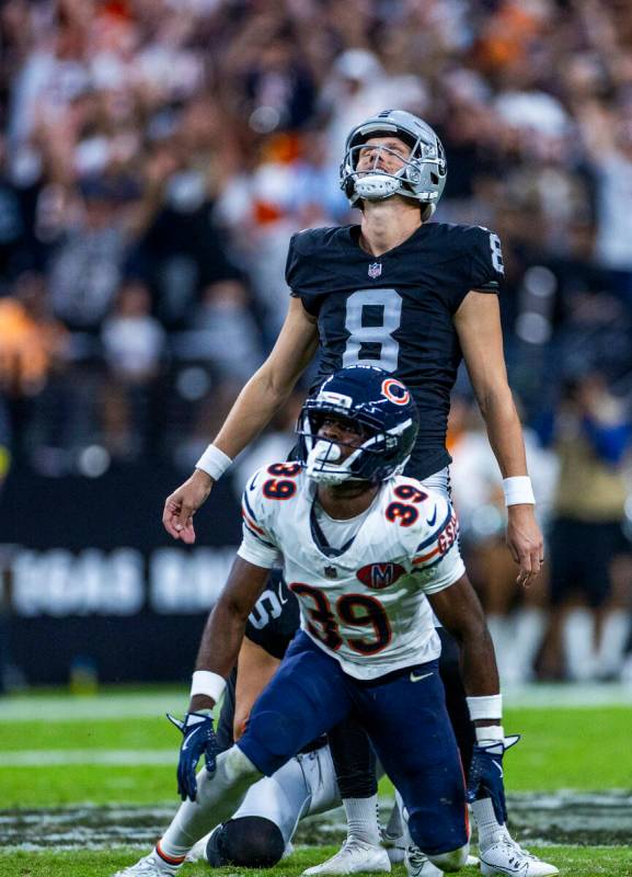 Raiders kicker Daniel Carlson (8) looks to a deflected kick by Chicago Bears cornerback Josh Bl ...