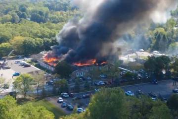 In this image taken from video released by Julie J, @Malkowski6April, Massive flames and smoke ...