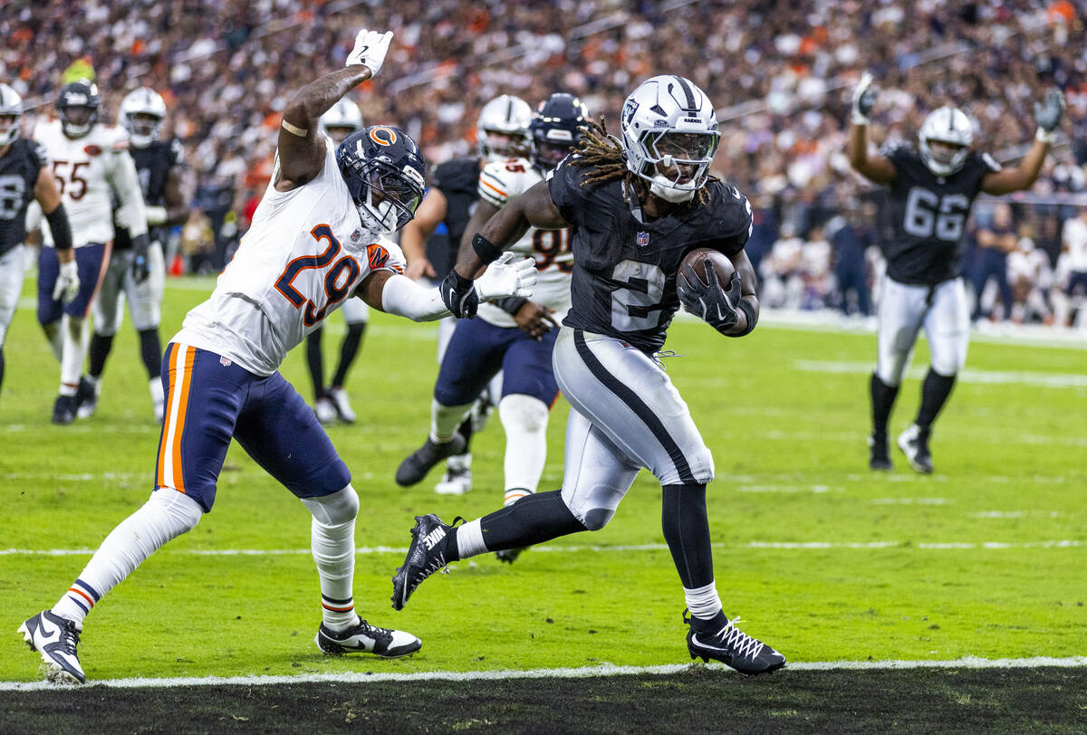 Raiders running back Ashton Jeanty (2) gets past Chicago Bears cornerback Tyrique Stevenson (29 ...