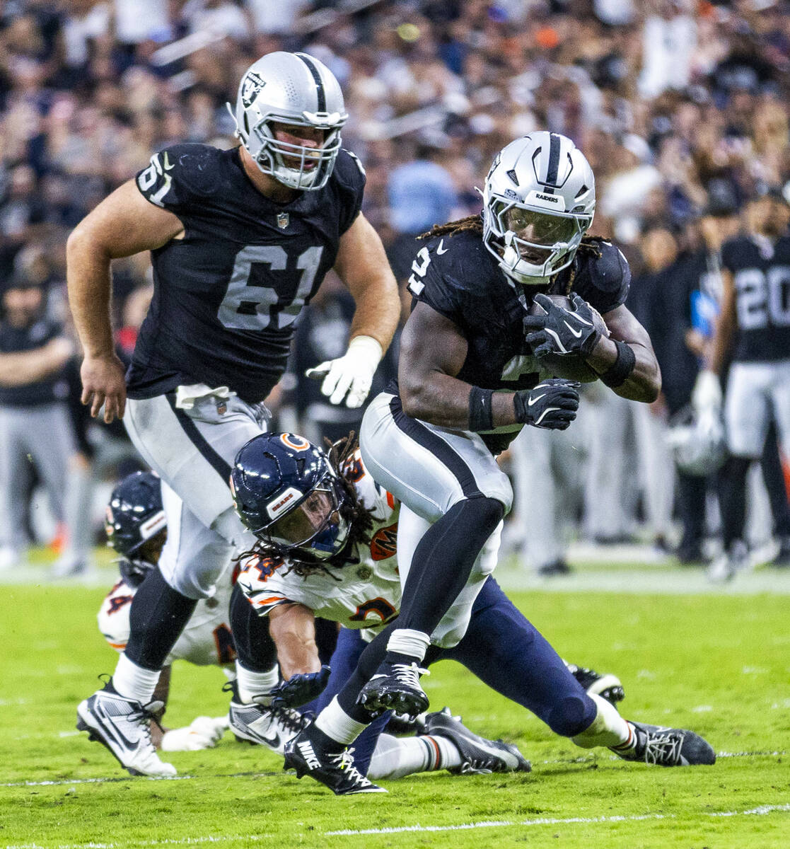 Raiders running back Ashton Jeanty (2) breaks free from a tackle attempt by Chicago Bears corne ...
