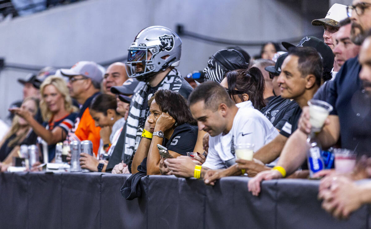 Raiders fans are dejected in the end zone seating as the Chicago Bears keep the team from scori ...