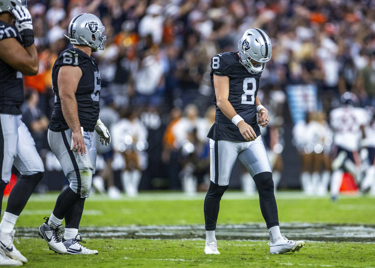 Raiders kicker Daniel Carlson (8) looks down after a deflection by Chicago Bears cornerback Jos ...