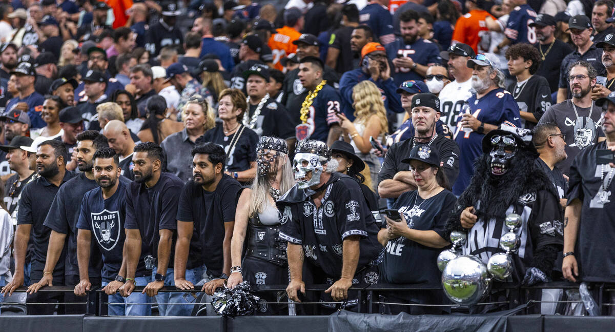 Raiders fans are dejected in the stands after a late loss to the Chicago Bears during the secon ...
