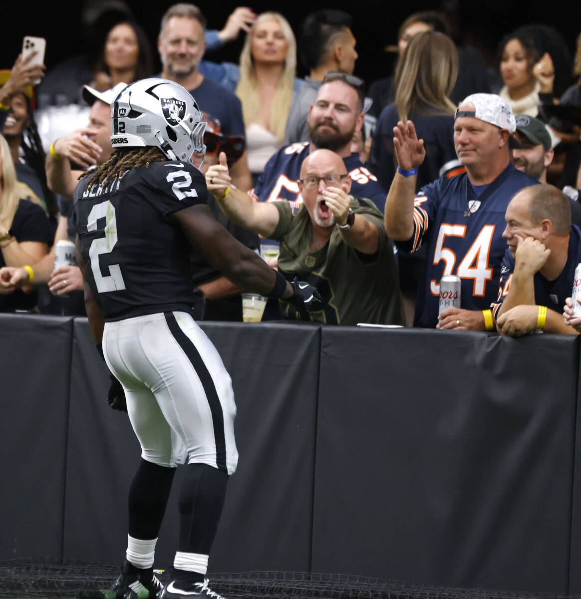 Raiders running back Ashton Jeanty (2) celebrates his touchdown during the first half of an NFL ...